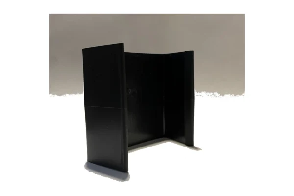Black plastic 2 gallon interlocking retaining clip standing upright, angled view on a grey background