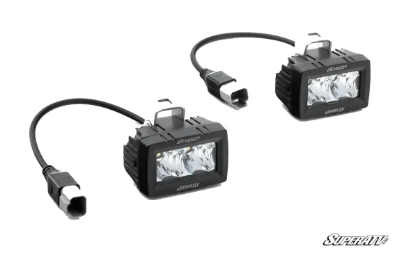Pair of black 3 x 1.5 inch single-row LED cube lights with sealed pigtail connectors and stirrup mounting brackets