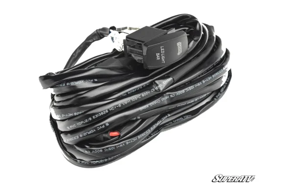 Coiled black wiring harness with inline fuse and a backlit rocker switch marked LED LIGHT BAR for a 30 inch light bar