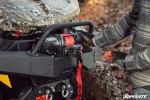 6000 lb. UTV winch shown in use, additional lifestyle view of the winch mounted and working