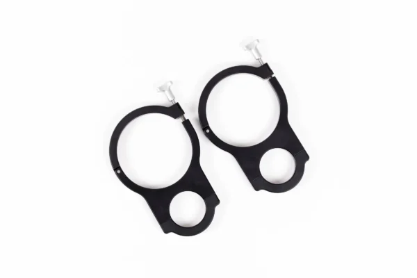 Pair of black aluminum RollpaX clamp mounts with silver T-knobs, viewed from above on white