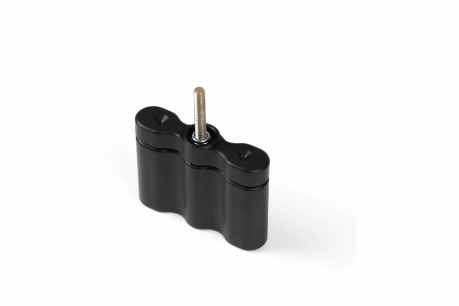 Black 1.75 gallon pack mount extension block with a stainless threaded stud, angled view