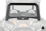 Black framed glass windshield with vent louvers in the lower trim, mounted on a Polaris RZR XP, front view