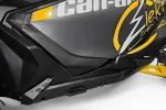 Volt rock slider fitted under the door of a black and yellow Can-Am Maverick R