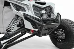 Machined billet front winch bumper fitted to a white Can-Am Maverick X3, shown with accessory lights