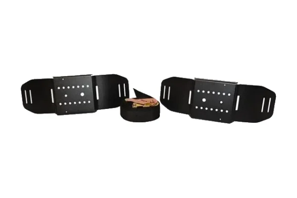 Two black powder coated EZ Tire Kit plates and a coiled ratchet strap laid out on white