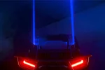 LED laser whip lights shown lit on a UTV, additional night view