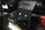 PAX roll bar mount clamped to a UTV cage tube with a FuelpaX handle attached above the cargo bed