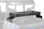 Black slotted bed rack with raised tray installed above a Polaris Ranger cargo bed