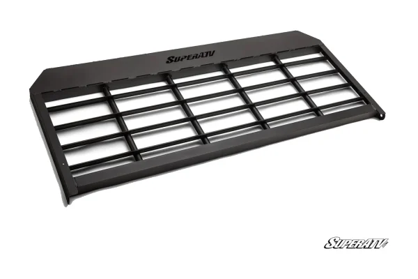 Black headache cargo rack with tubular grid guard and flat top shelf, isolated product view