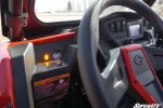 Toggle switch and a lit amber indicator on the dash of a red Polaris RZR