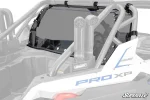 Dark tinted rear windshield mounted behind the seats on a white Polaris RZR Pro XP