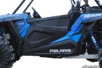 Black molded plastic door installed on a blue Polaris RZR, side view with the door opening fully covered
