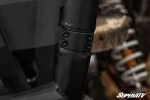 Close-up of the bolt-on clamp collar joining the mounting arm to the upright on the RZR XP Turbo rear bumper