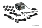 RGB rock light kit laid out with sealed LED pods, mounting plates, wiring harnesses and a control module