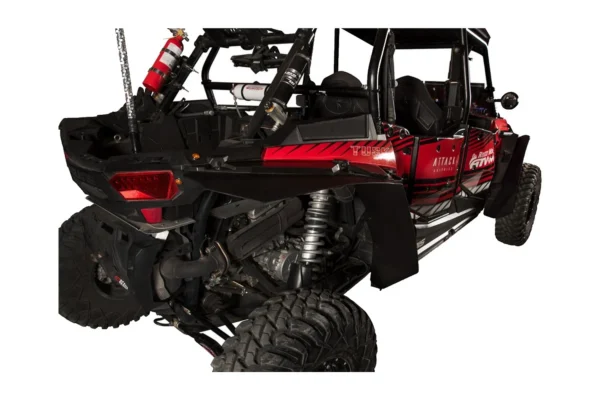 Black Tusk fender flare over the rear wheel of a red Polaris RZR