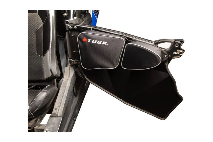 Black Tusk padded upper door bag mounted on a UTV door panel beside the seat