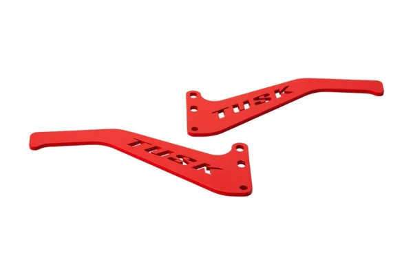 Pair of Tusk red aluminum door latch handles with cutout TUSK logo, isolated at an angle