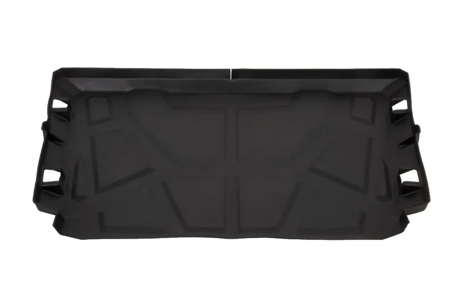 Black TPE Tusk bed mat molded for the Polaris General, top down view showing the raised tread pattern