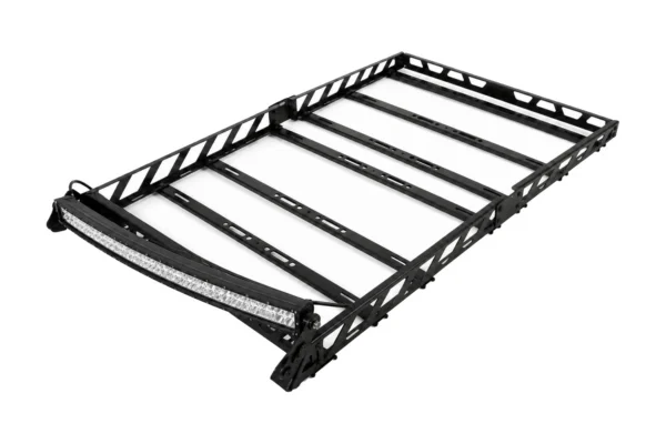 Tusk black steel UTV adventure roof rack with curved LED light bar at the front, angled view