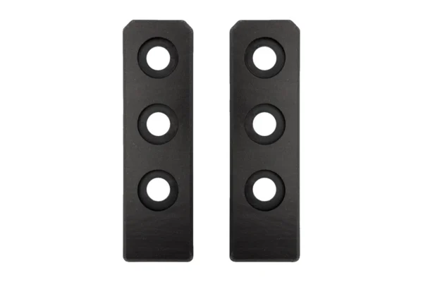 Pair of Tusk black replacement slider pads with three countersunk holes, front view