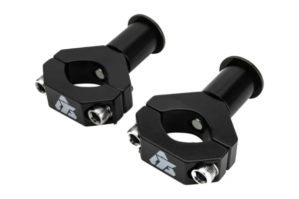 Pair of Tusk black CV axle mount clamps with barrel spacers and bolts, isolated