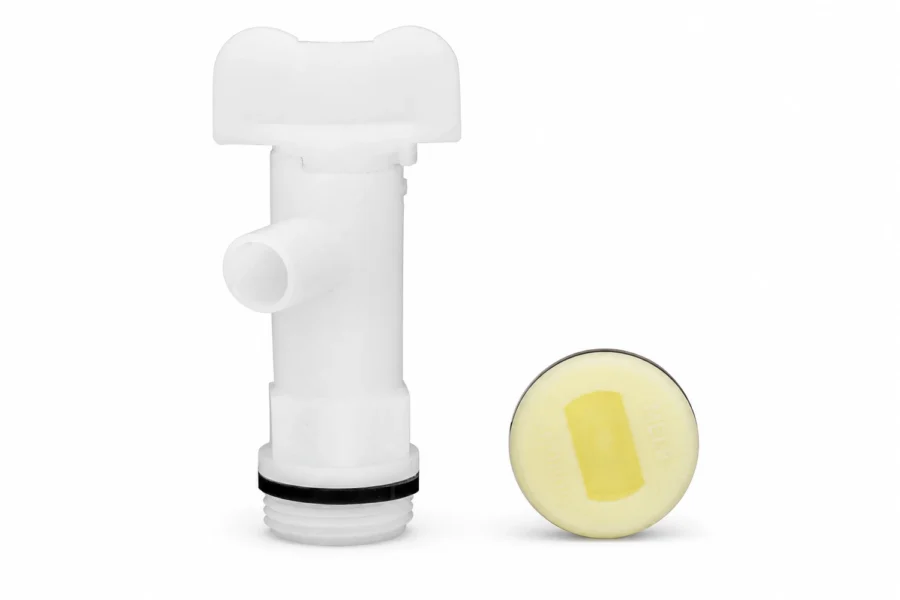 White Wavian water can spout tap beside a round yellow-centered plug on white