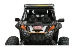 Front view of the folding glass windshield installed on a Kawasaki KRX with roof light bar