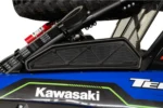 Tusk black intake cover installed on a blue Kawasaki Teryx KRX beside the spare tire and drive belts