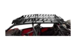 Black Tusk roof rack mounted on top of a red UTV roll cage, side view