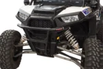 Tusk black front bumper installed on a white Polaris RZR, front three-quarter view