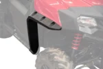 Black Tusk front fender flare installed on a red UTV beside the red front shock