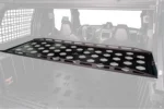 Tusk cargo rack highlighted in a UTV bed showing its mounting position