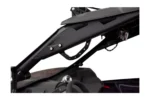 Tusk grab handle mounted along the cage tube of a Can-Am X3, viewed from below near the dash
