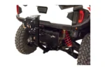 Tusk spare tire carrier mounted at the rear hitch of a white Polaris, no tire fitted