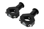 Pair of Tusk black CV axle mount clamps with barrel spacers and bolts, isolated