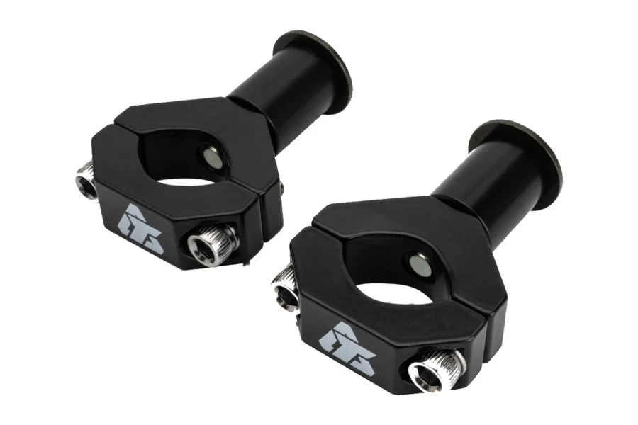 Pair of Tusk black CV axle mount clamps with barrel spacers and bolts, isolated