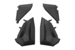 Set of four Tusk black plastic lower door inserts for UTV, front faces shown, isolated