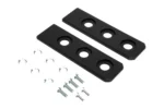 Pair of Tusk slider pads with mounting washers and bolts, angled view on white