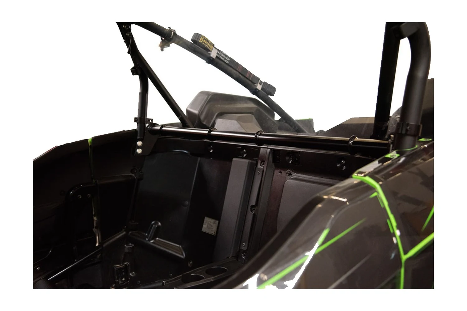 Tusk black harness bar installed behind the seats in a Kawasaki Teryx KRX cockpit