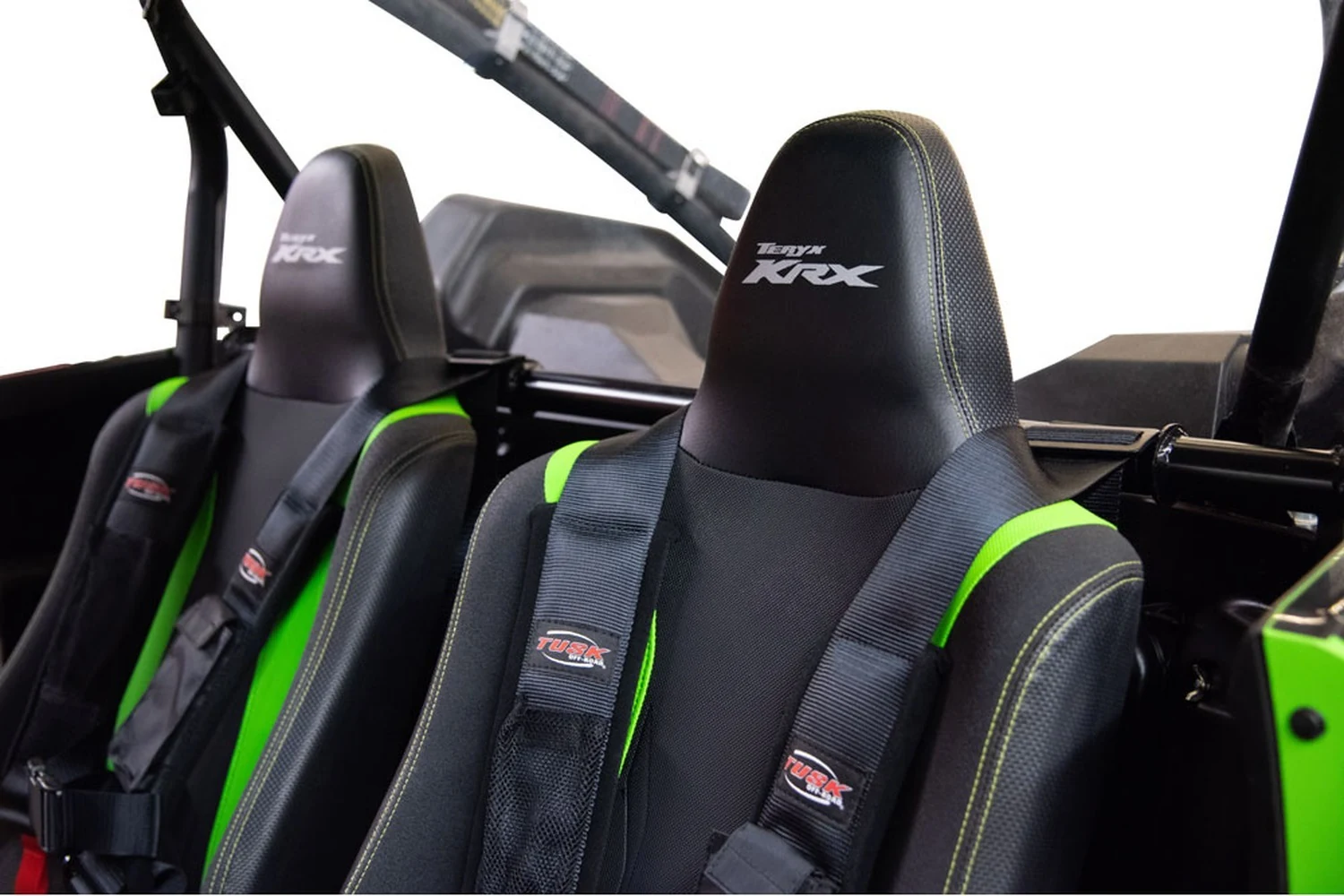 Kawasaki Teryx KRX seats fitted with Tusk harnesses attached to the harness bar