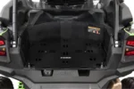 Tusk cargo rack installed in the rear bed of a green Kawasaki UTV, viewed from behind