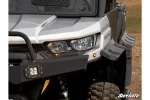 Amber turn signal indicator lights lit at the front corner of a Can-Am Defender HD10